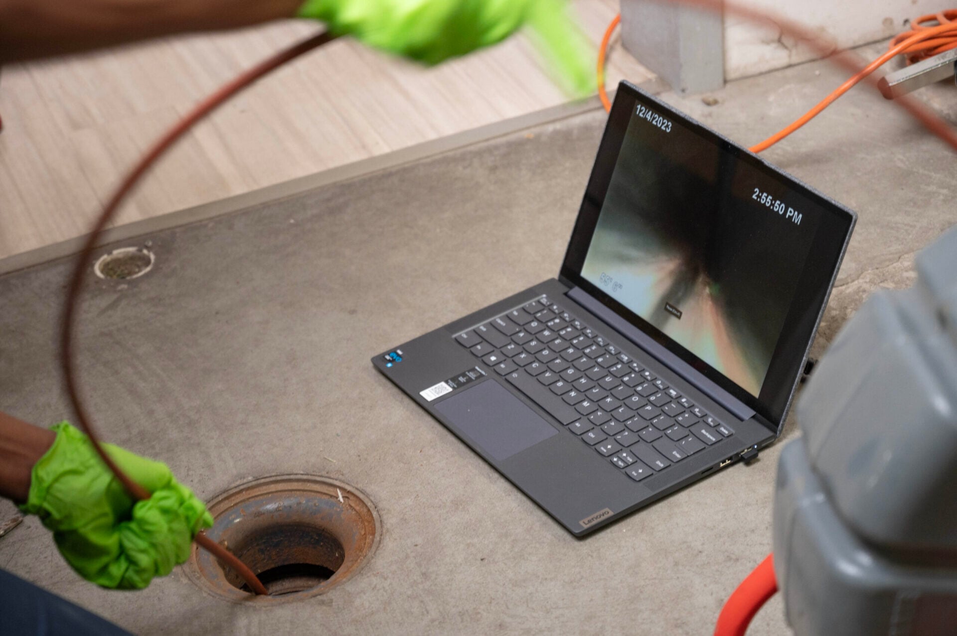 Professional sewer camera inspection detecting blockages in a residential drain system, displayed on a laptop screen.