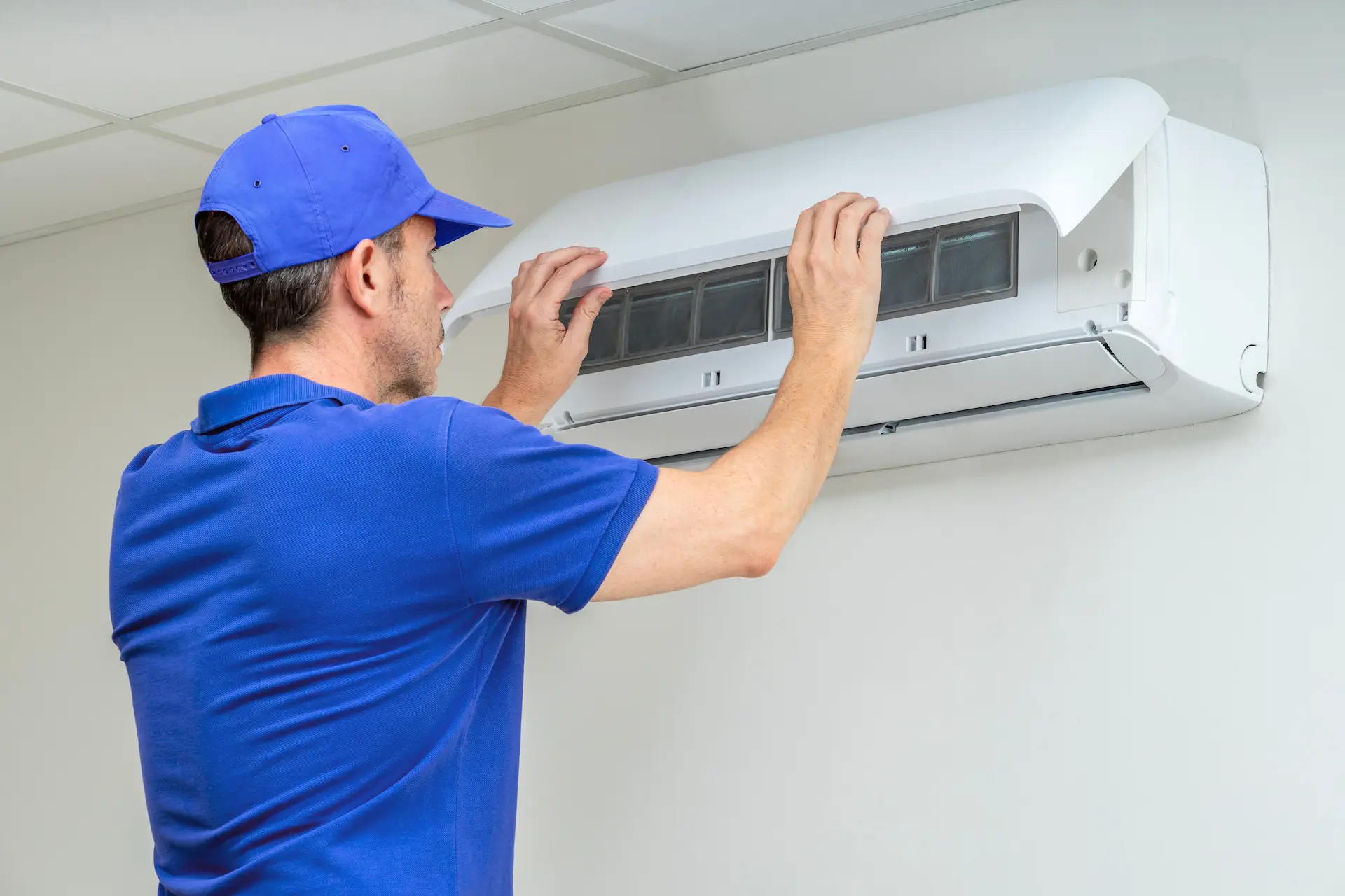 HVAC Technician performing AC Inspection reviews