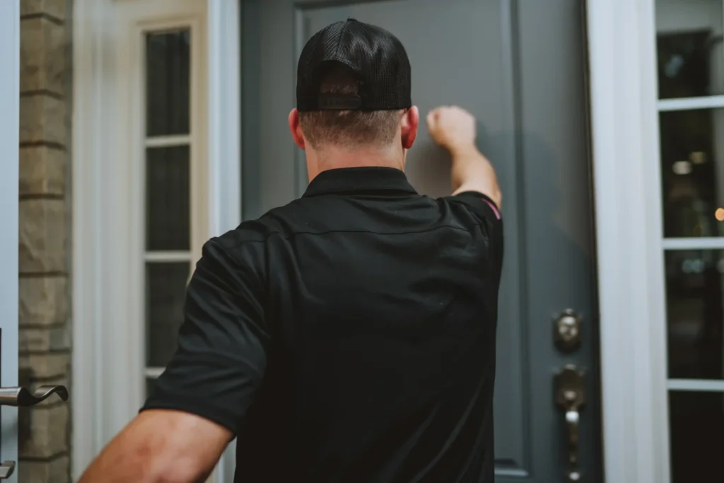 Technician knocking on door